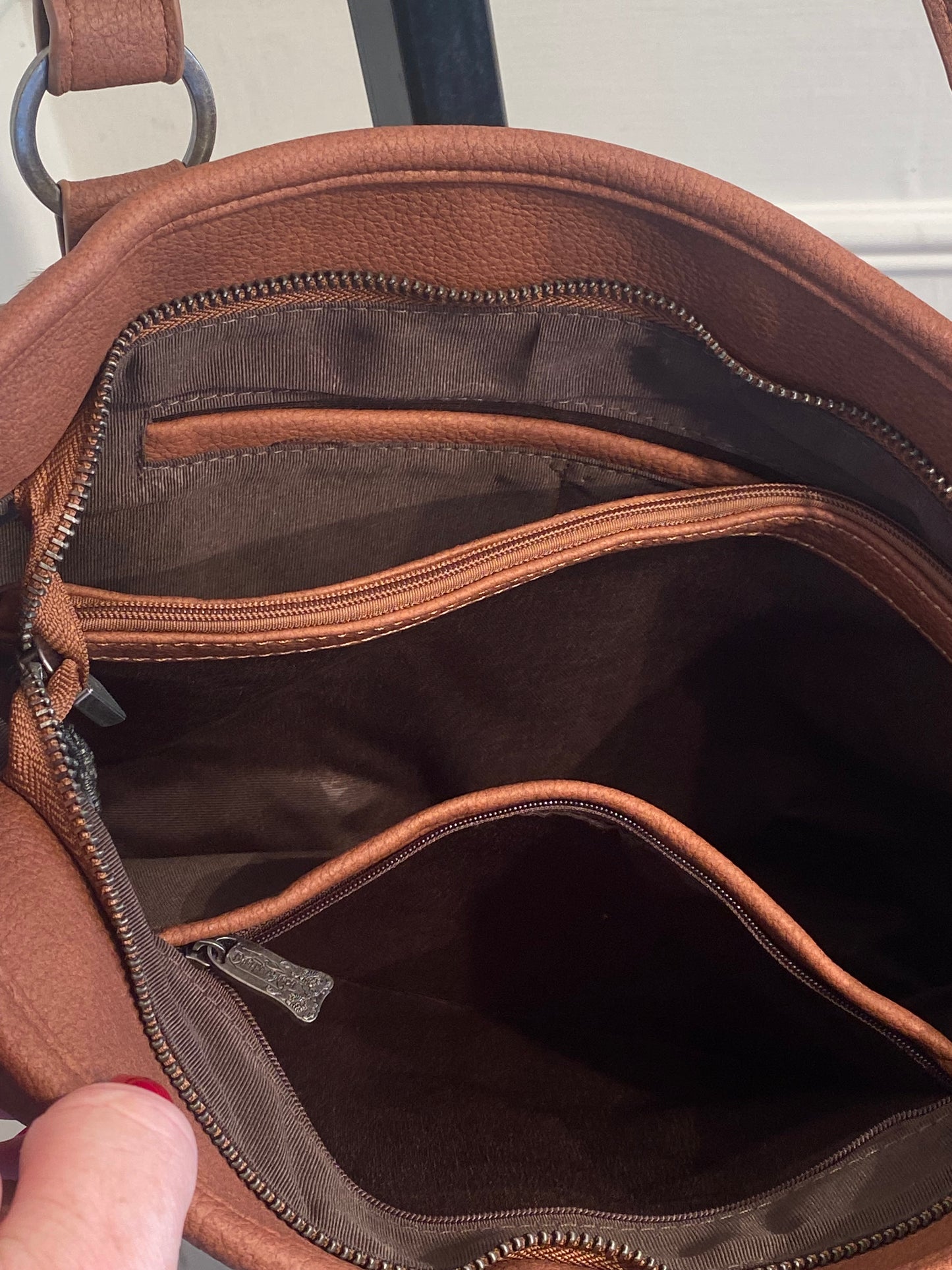 TRINITY RANCH HAIR ON COWHIDE CONCEALED CARRY TOTE